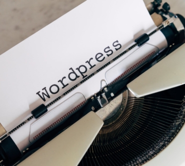 white vintage typewriter with paper