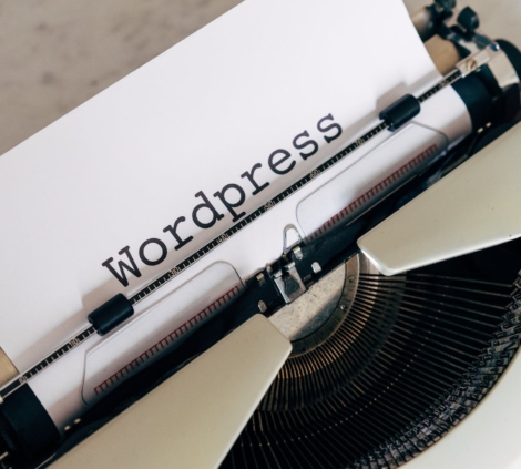 white vintage typewriter with paper