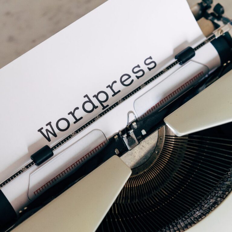 white vintage typewriter with paper